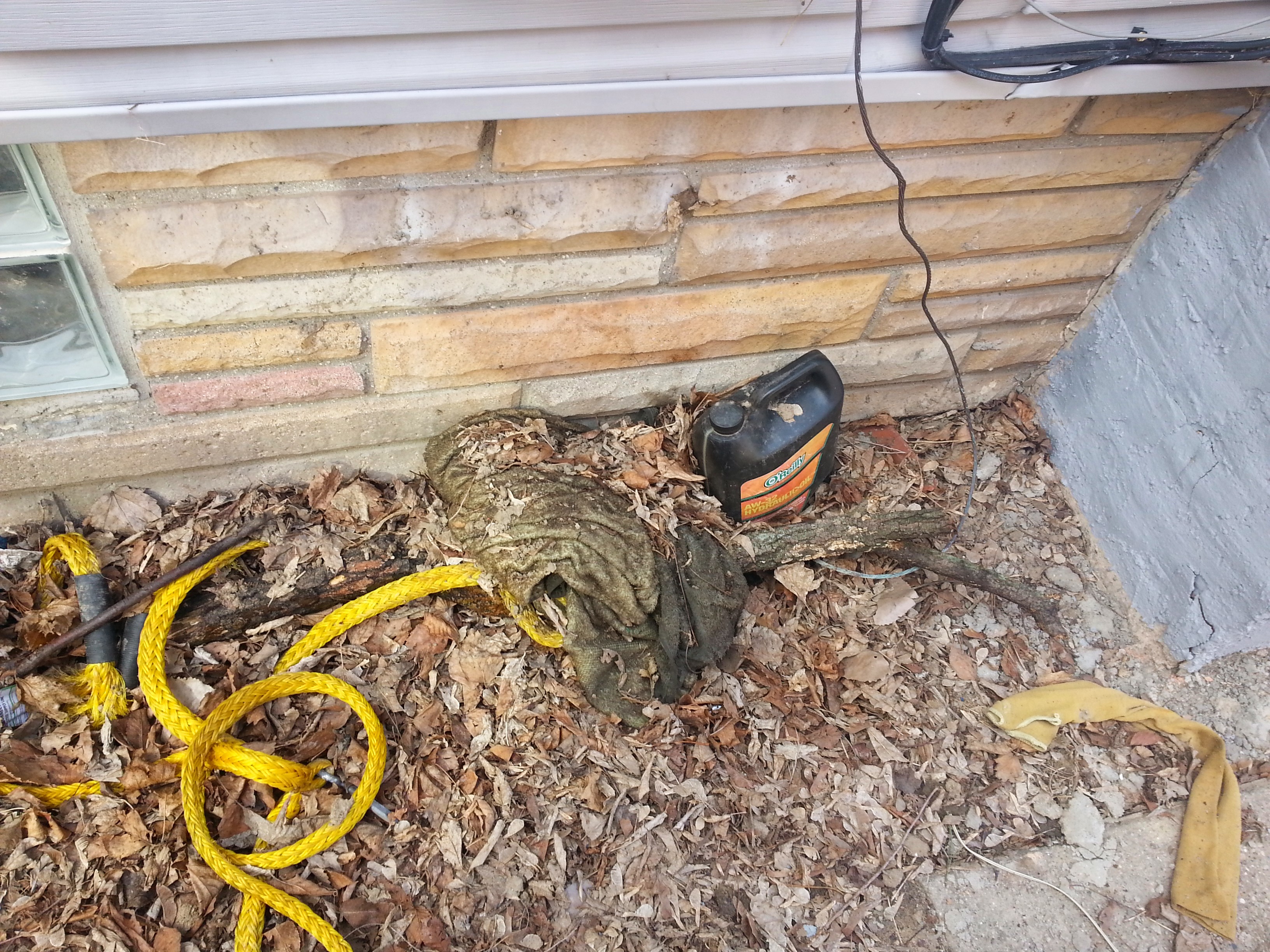 debris left on side of home from Garner Properties