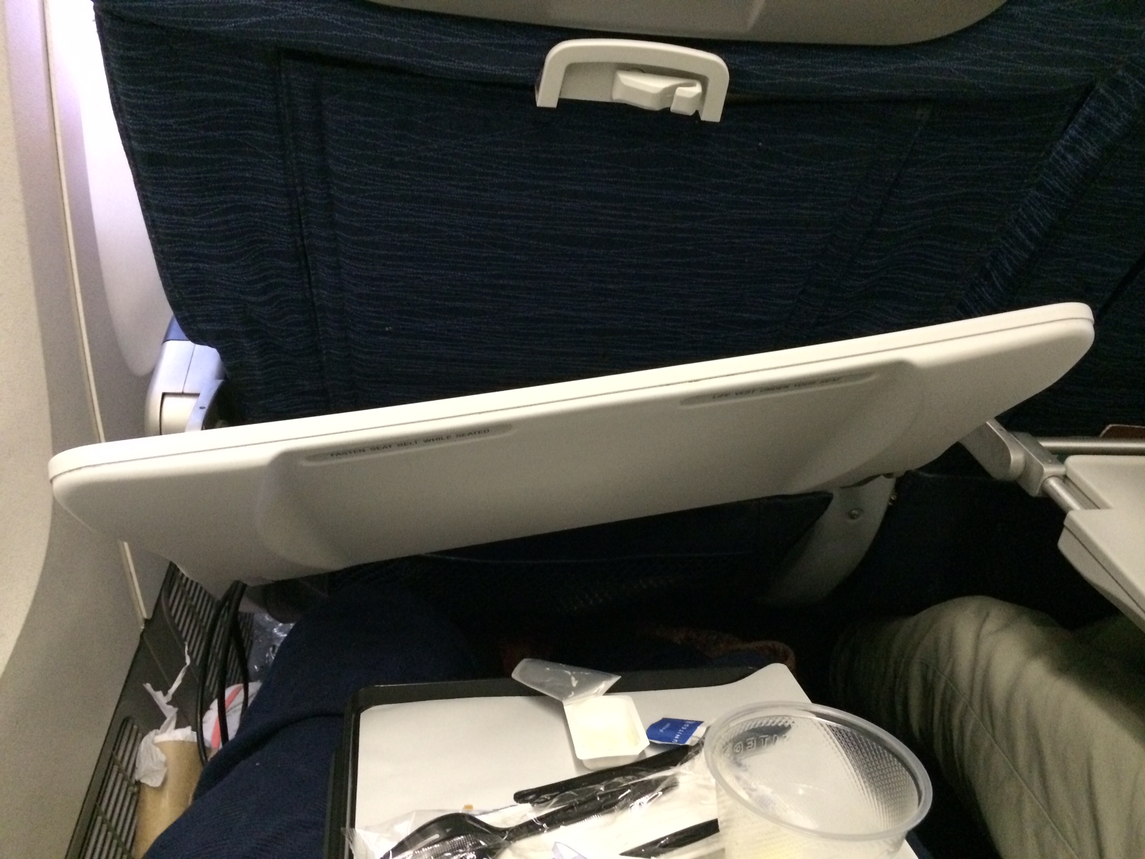 Photos of the broken tray table. Very nice, United. Thanks for the horrible service.