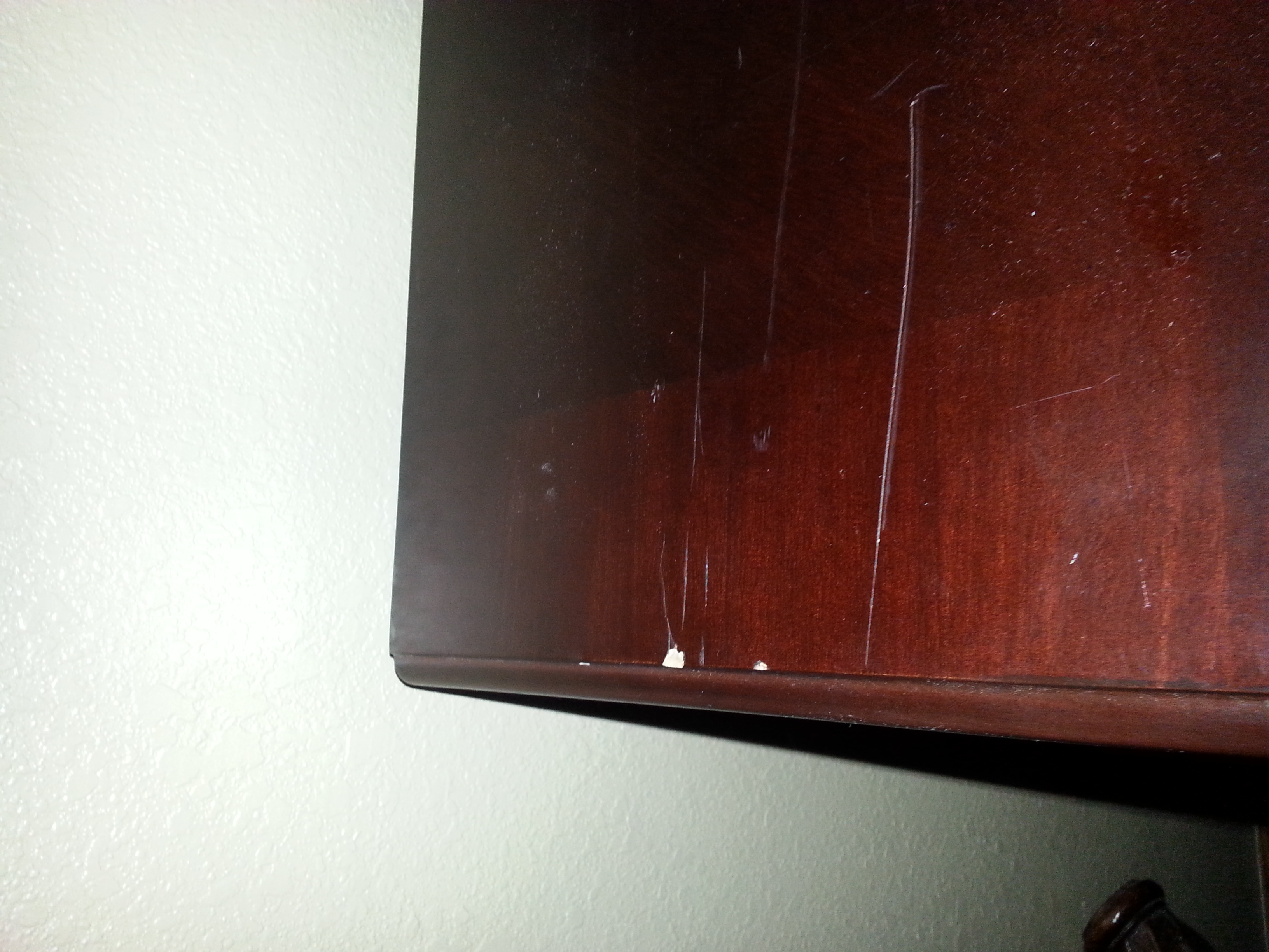 This was a brand new dresser, less than a year old. This is just one of about fifteen items they damaged.