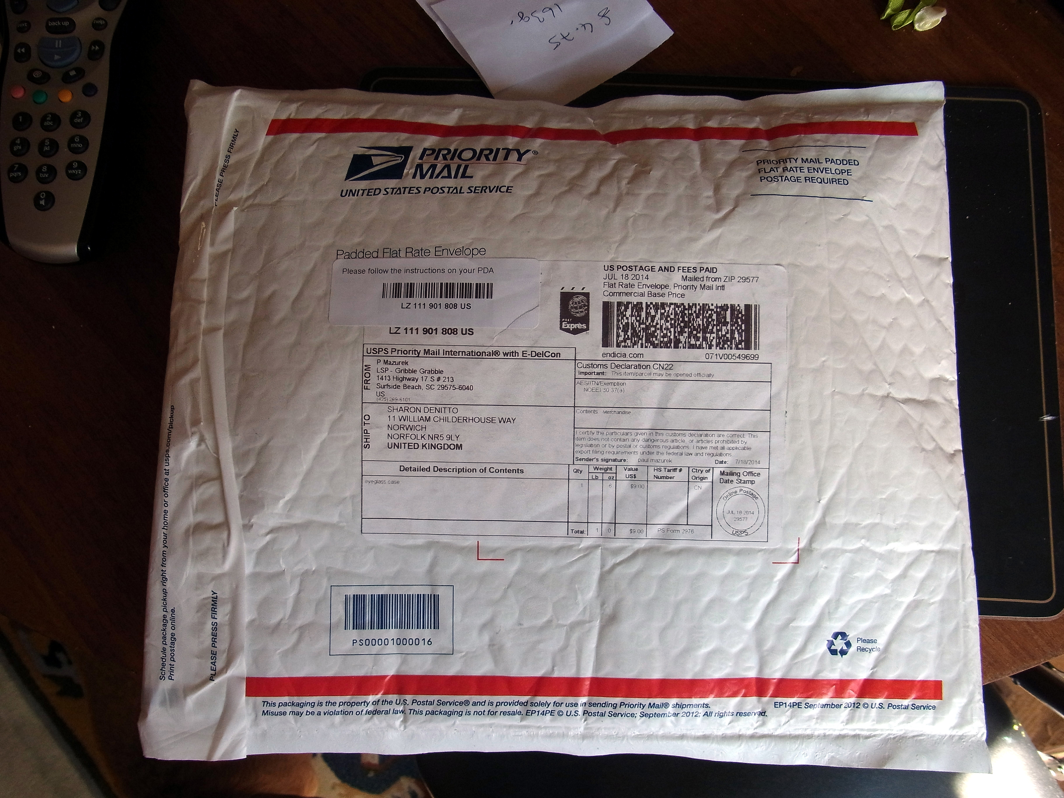 The large package they used to ship a 5 oz, 6 in long 1/4 in thick flat needlepoint sunglass sleeve
