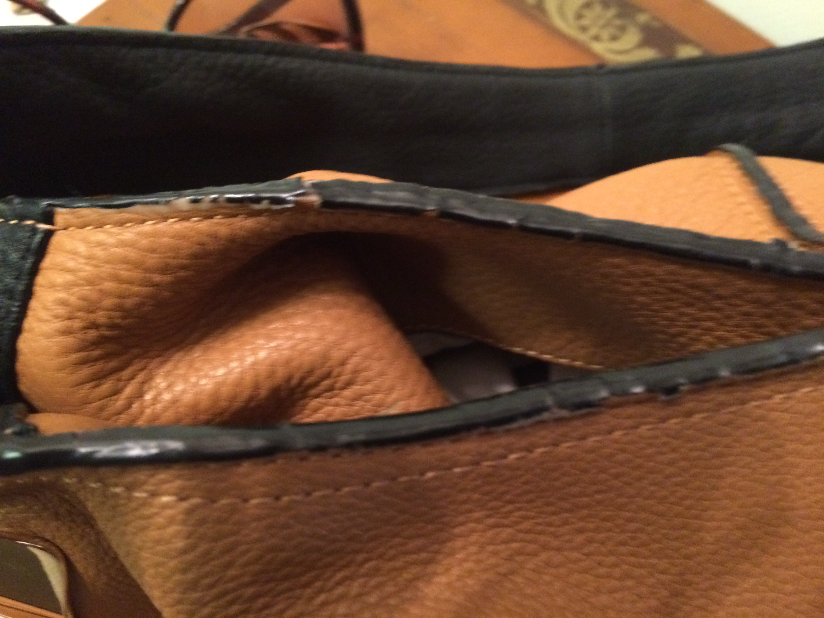More disintegrating "leather" in a new Halston bag.