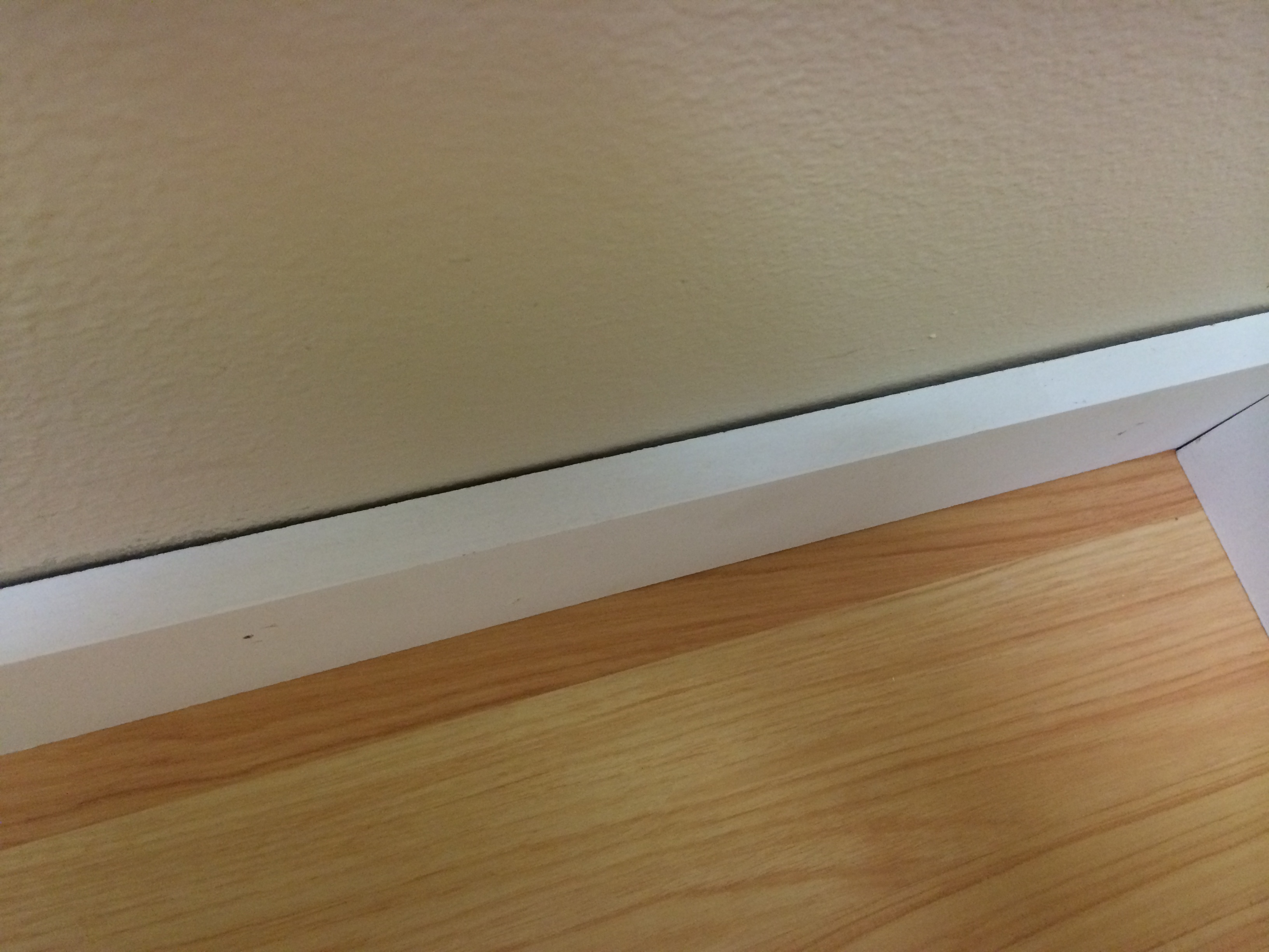 Gap between wall and baseboard by Norman Fitoria