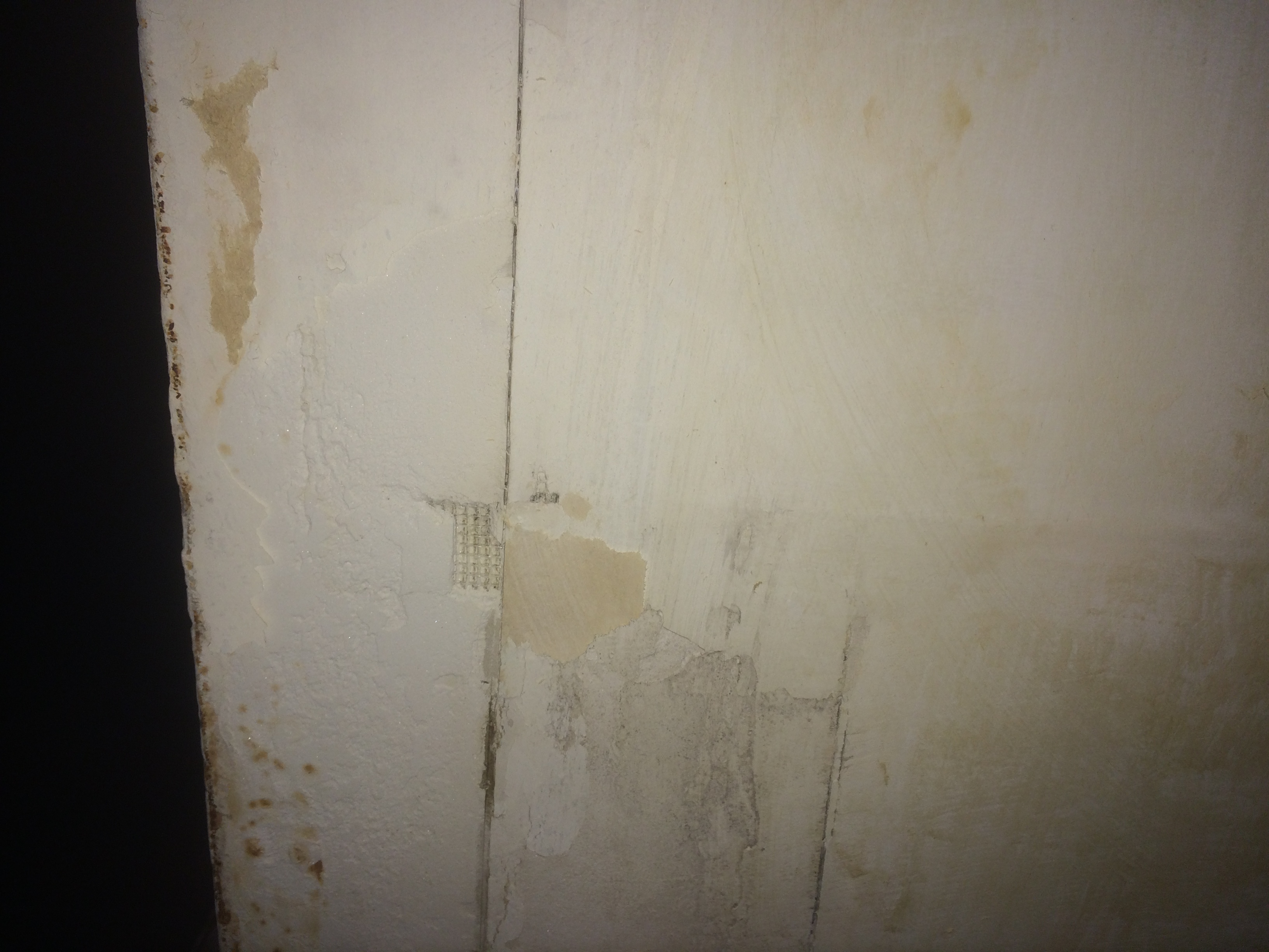 Walls gouged from workers basically digging knives into the paper.