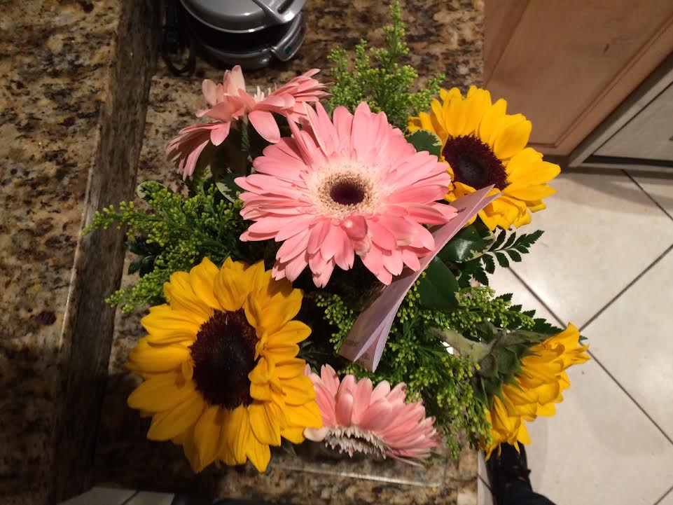 I ordered white roses and sunflowers and got pink daisies (I think) and sunflowers