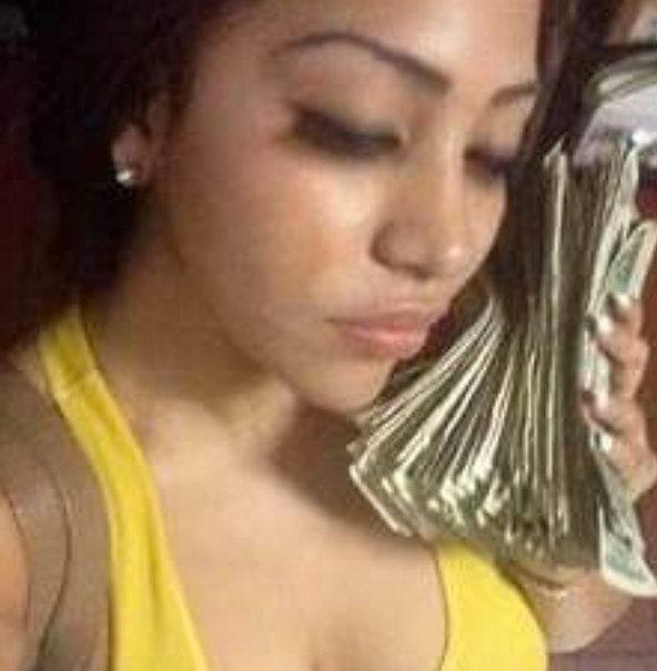 This is her with all the peoples money she has scammed 