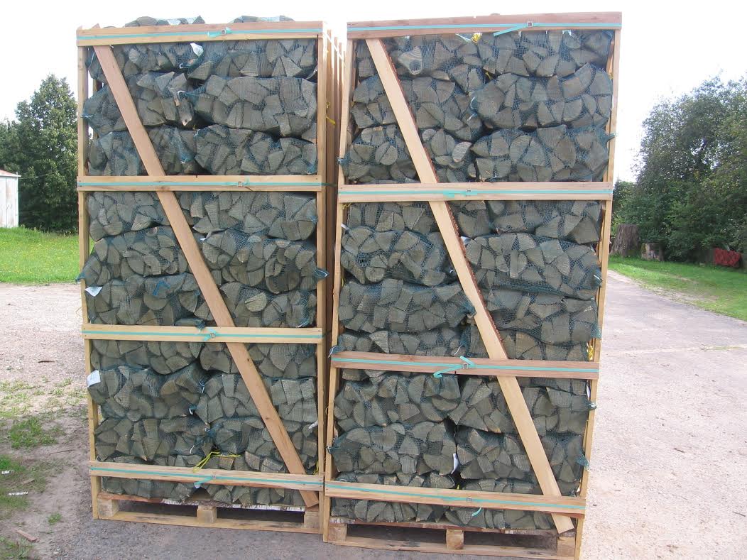 firewood in net bags on pallet boxes