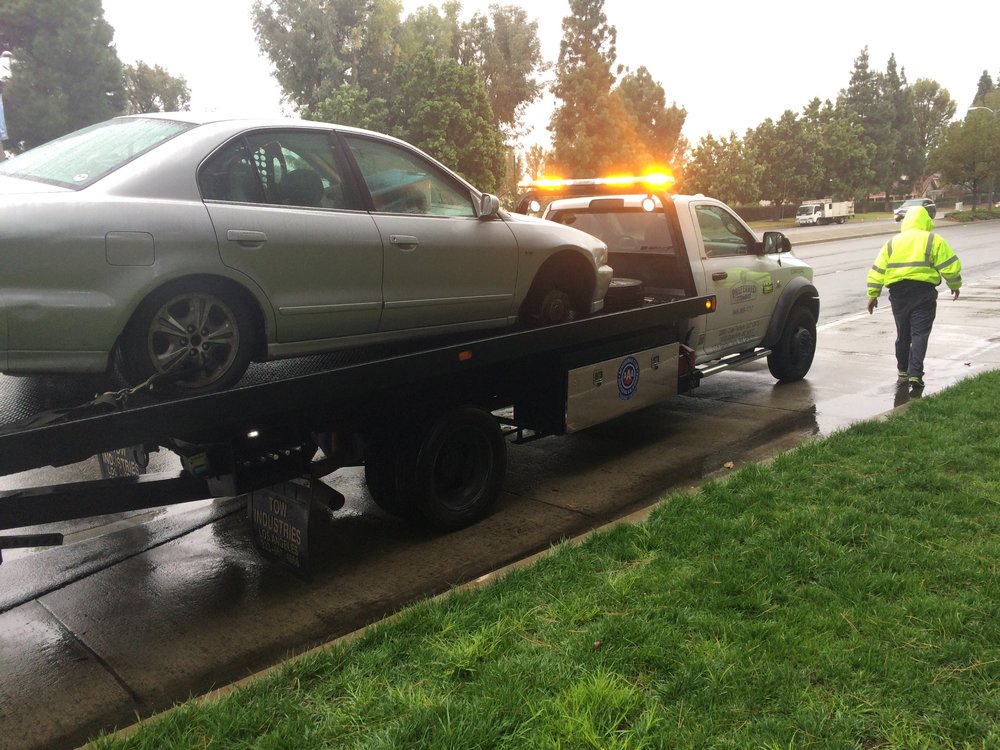 Car being towed away by AAA after the wheel fell off.