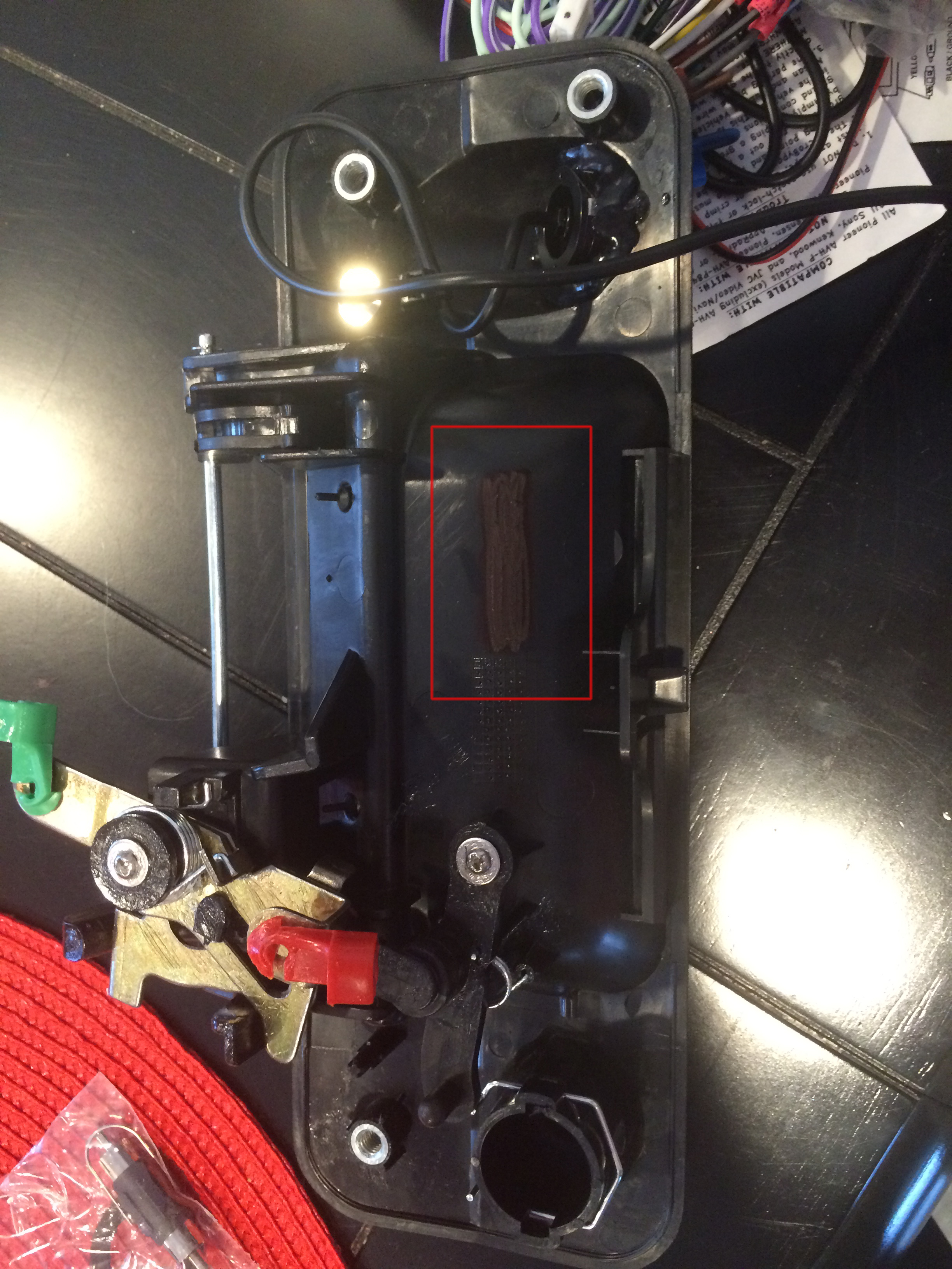 Square shows defacing of the part number and notice the hand glued camera