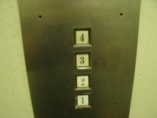 Old broken elevator buttons.