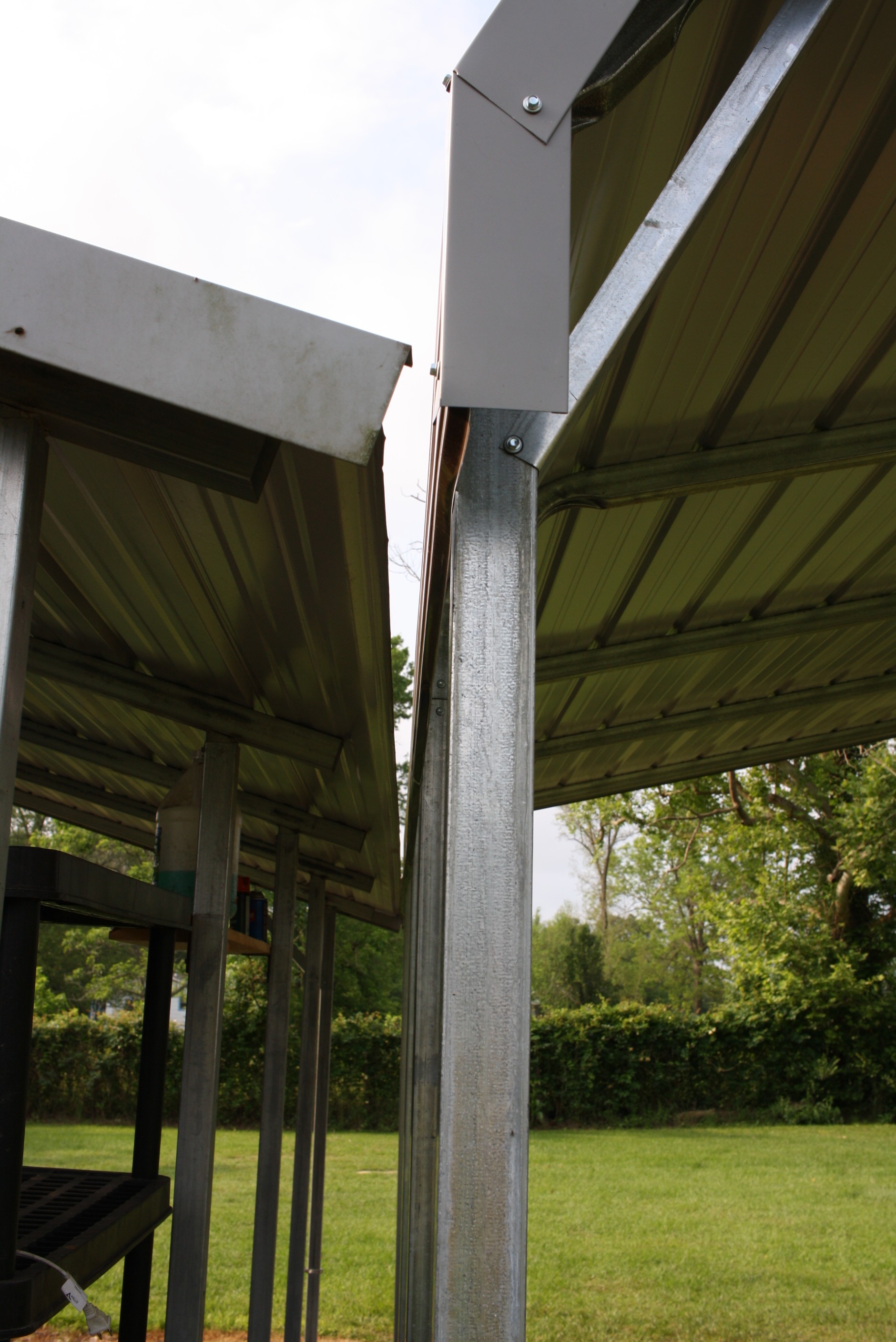 One end up against our existing carport, one end 2" off