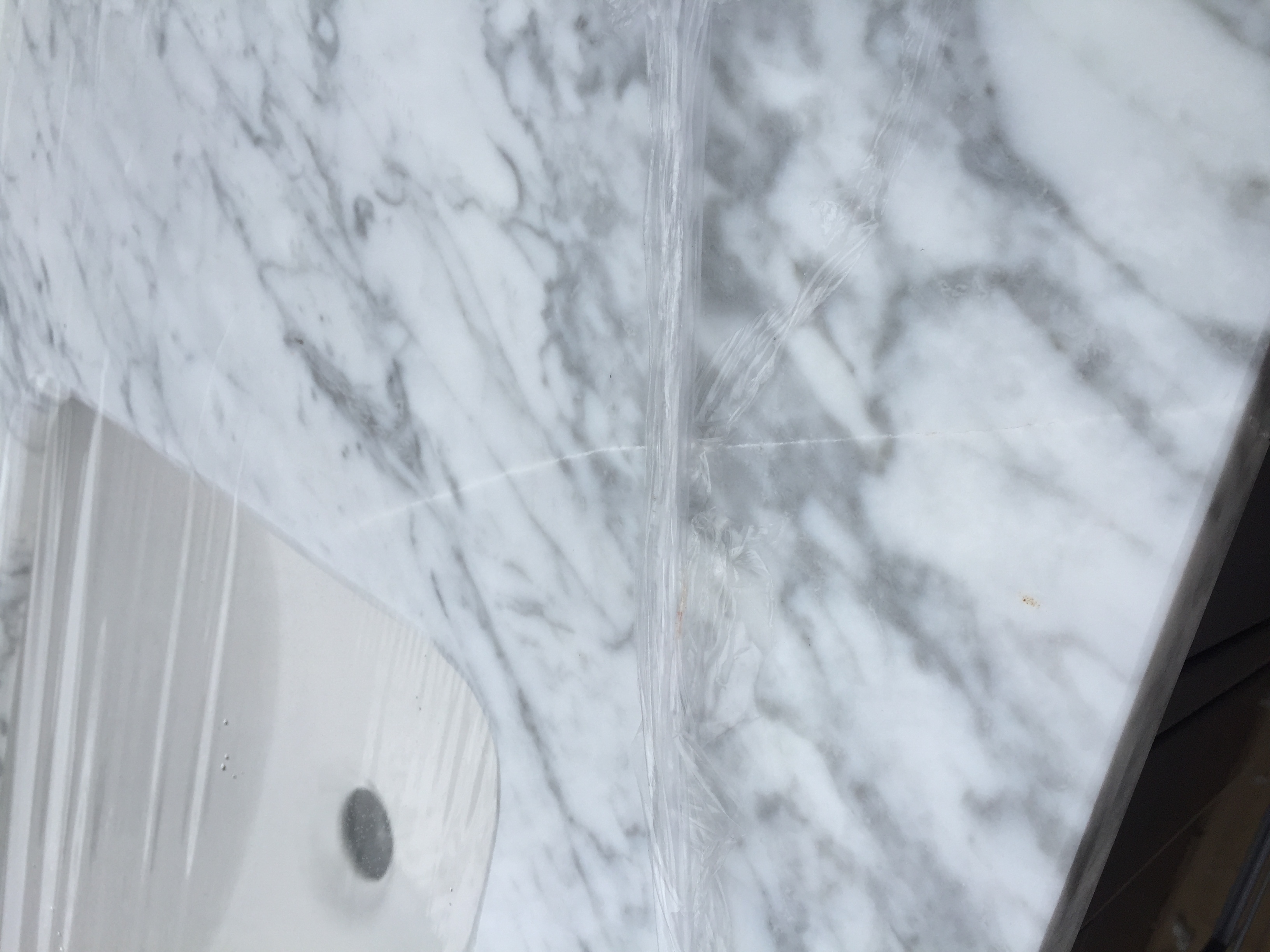 The marble vanity top was cracked from the bowl to the side in three different places