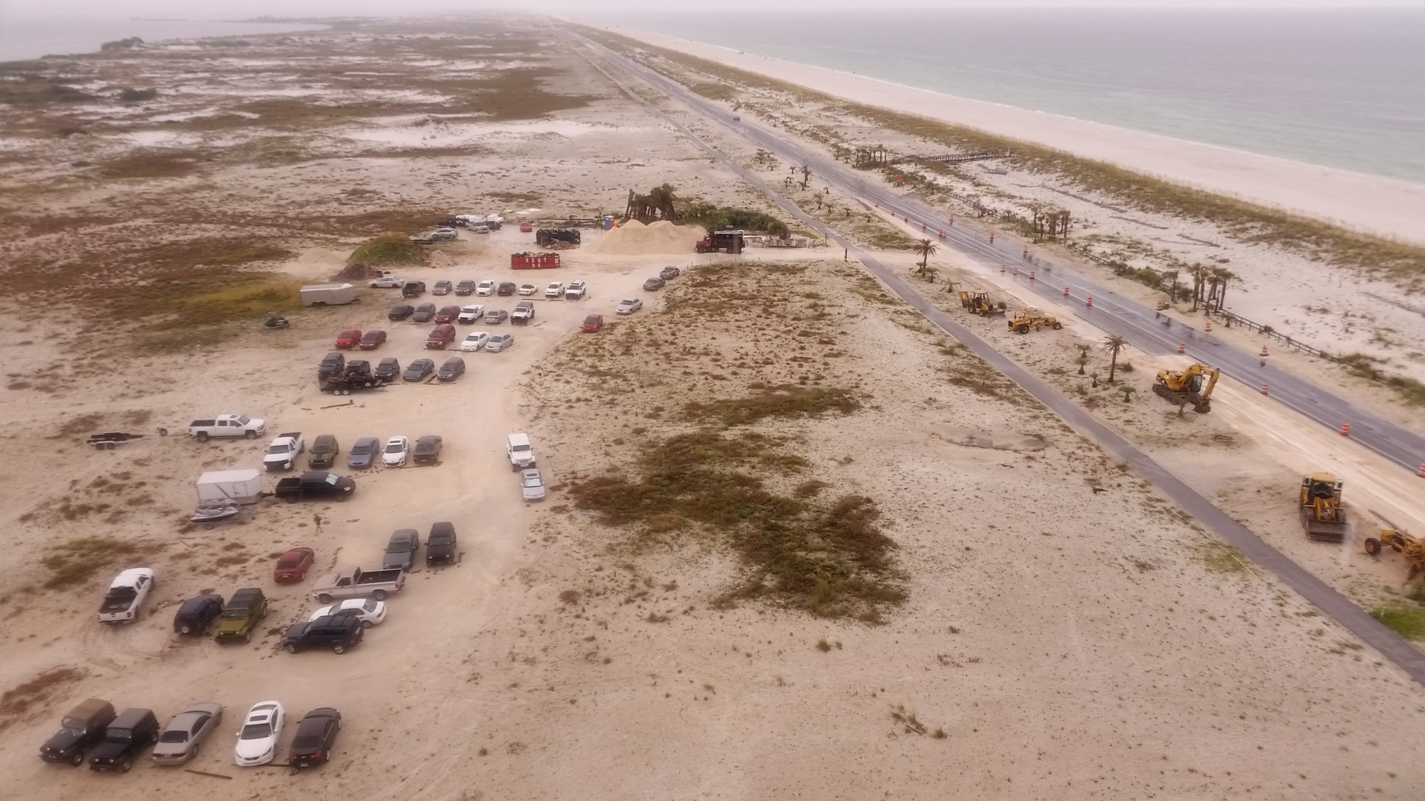 Owner promised, "the only thing you will see looking out the 40 feet of windows and deck is the Gulf of Mexico and Santa Rosa Island." Did not say anything about a busy uncovered parking lot right bel