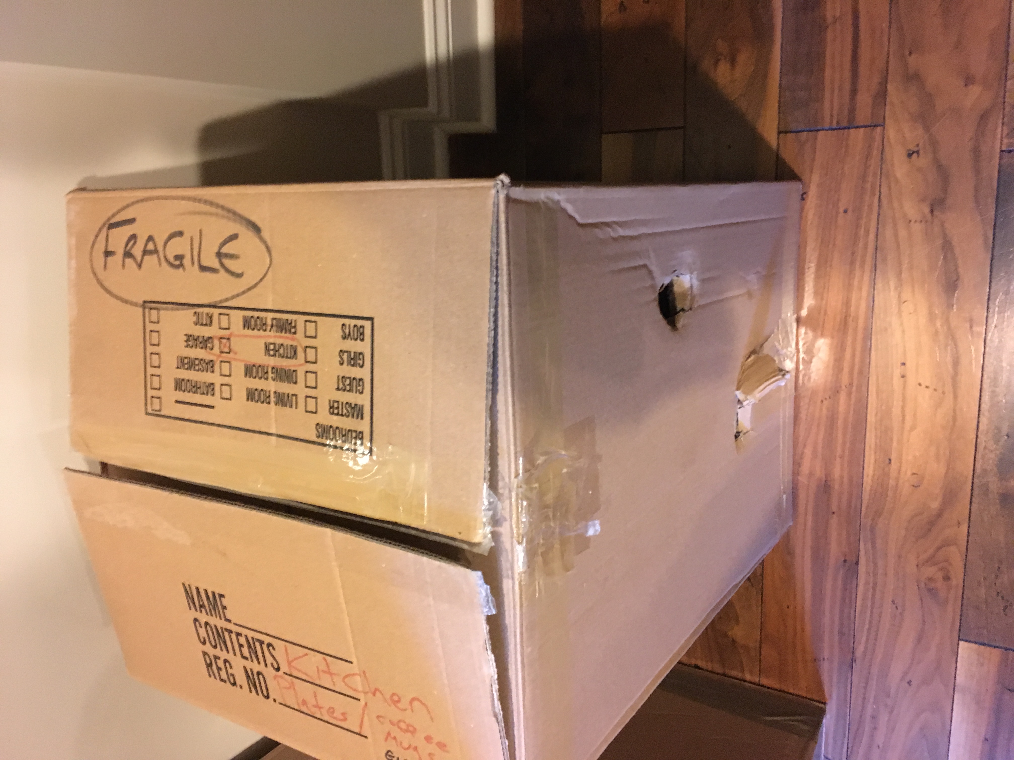 holes dented into a box marked FRAGILE