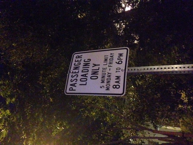 Close up of standard loading zone sign. Non-residential with no mention of permit required on this block anywhere.