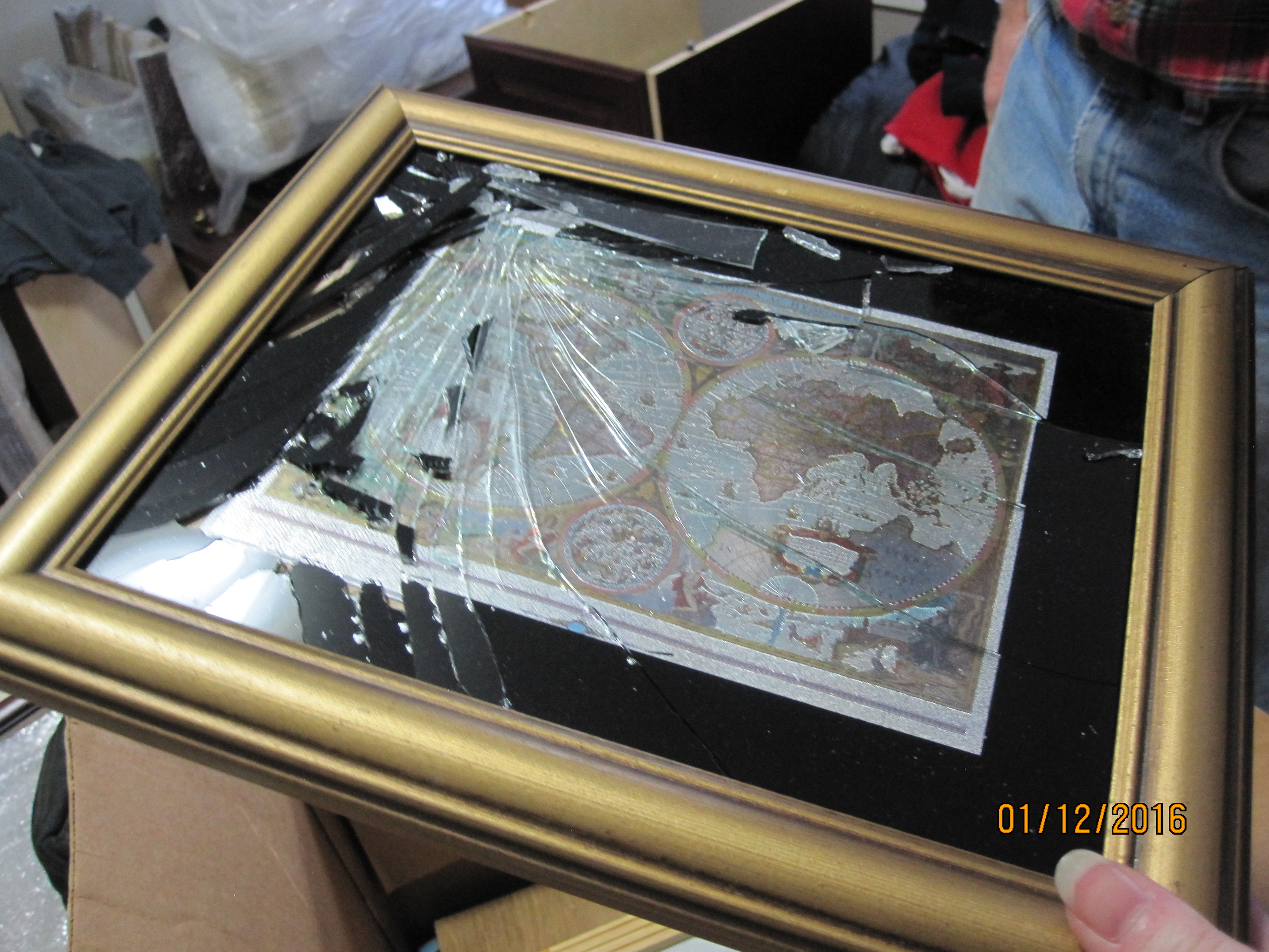 One of the many broken paintings, due to being packed incorrectly