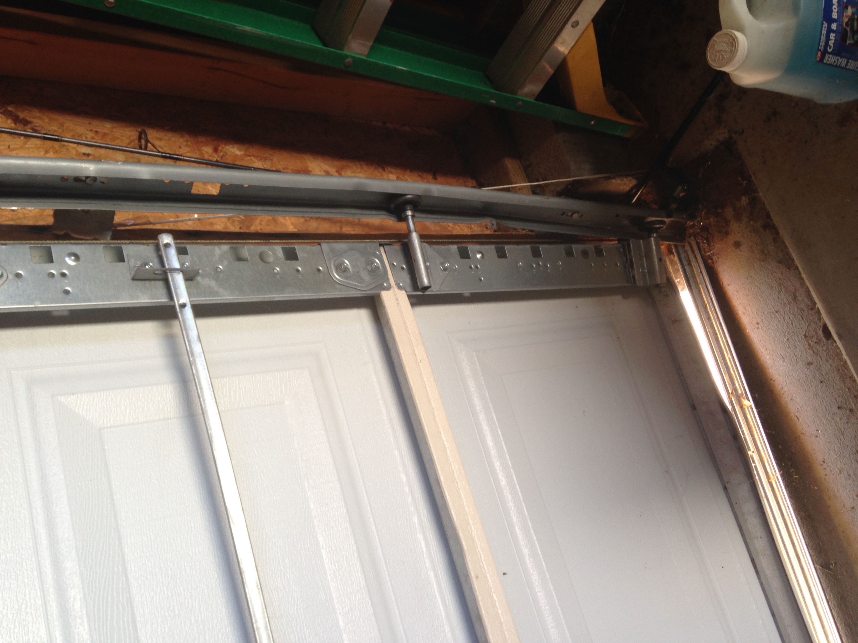 Damage to the garage door.