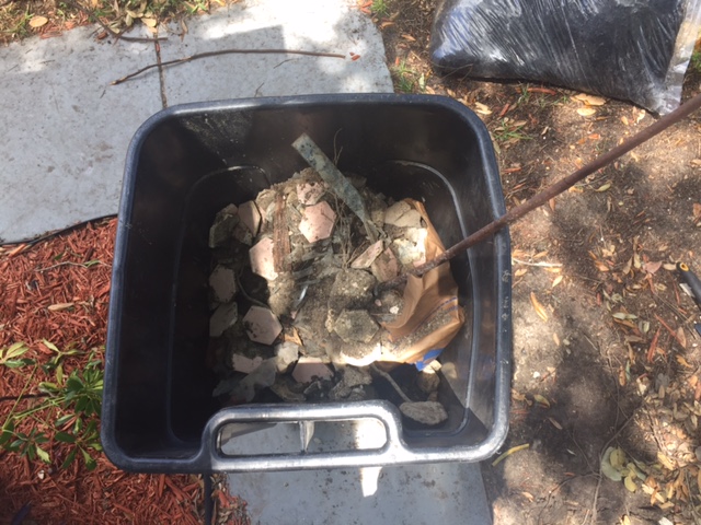 5th garbage can filled with waste they buried. Glass,tile,steel,electrical