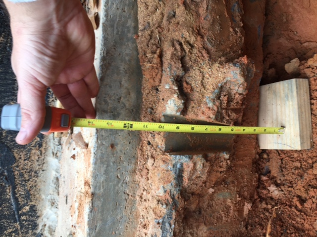 CODE REQUIRES THAT THE FOOTING BE AT LEAST 16" DEEP. THIS FOOTING IS ONLY 11" DEEP.