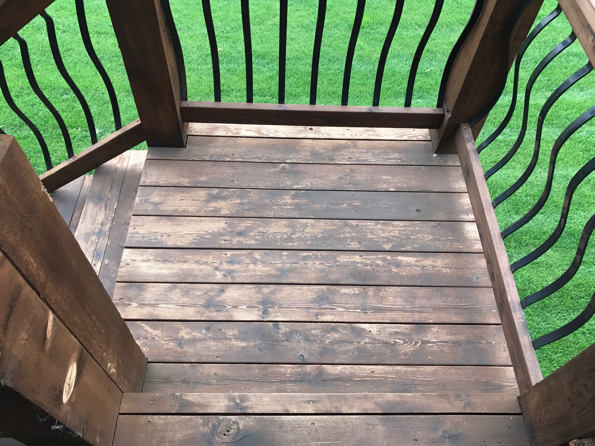 More patchy and flaking off stain.