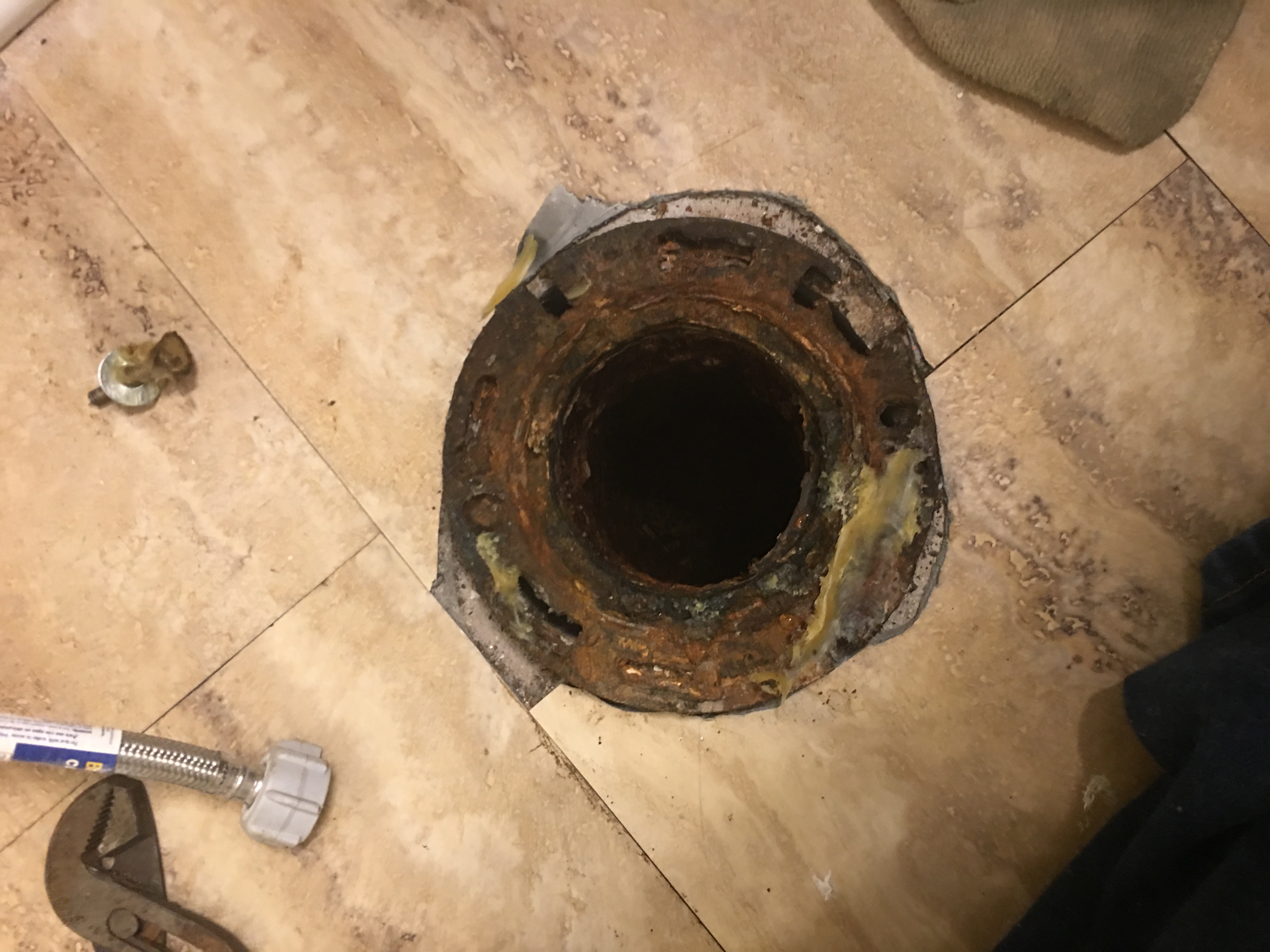 Broken flange that wasn't replaced by Anthony Hartman of Absolute Home Renovations.  The toilet was. It bolted down and leaked