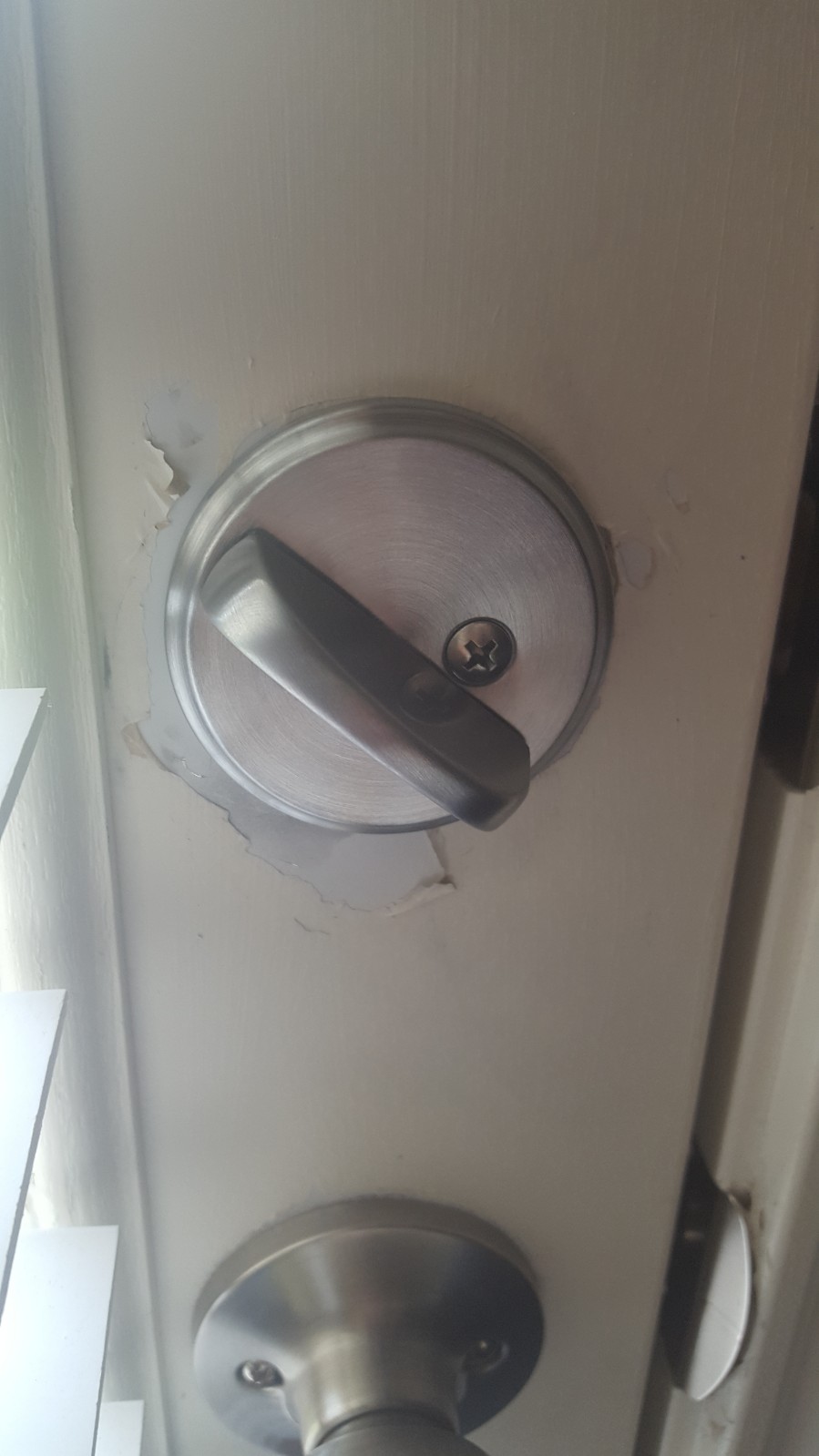 pic of new back door lock and door damage #1