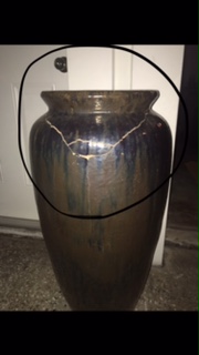 damaged antique urn