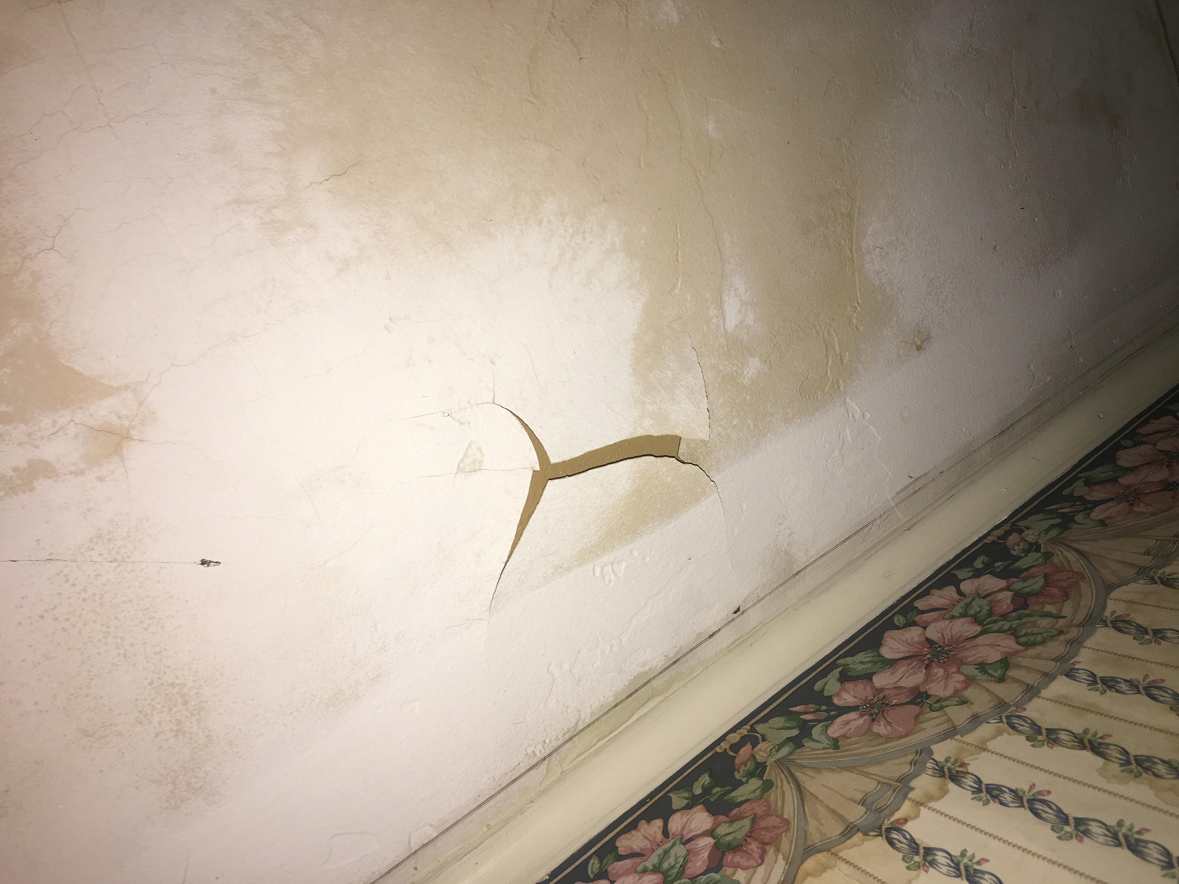 Damaged ceiling about to cave in