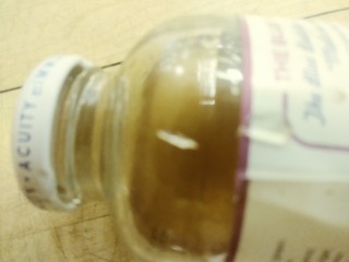 picture of the bottle with the broken glass pieces