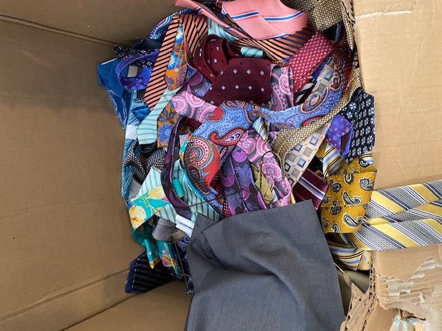 Ties each worth $200+ in a ball at bottom of box.