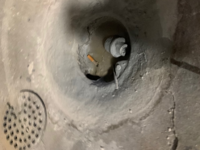 main drain clogged with concrete