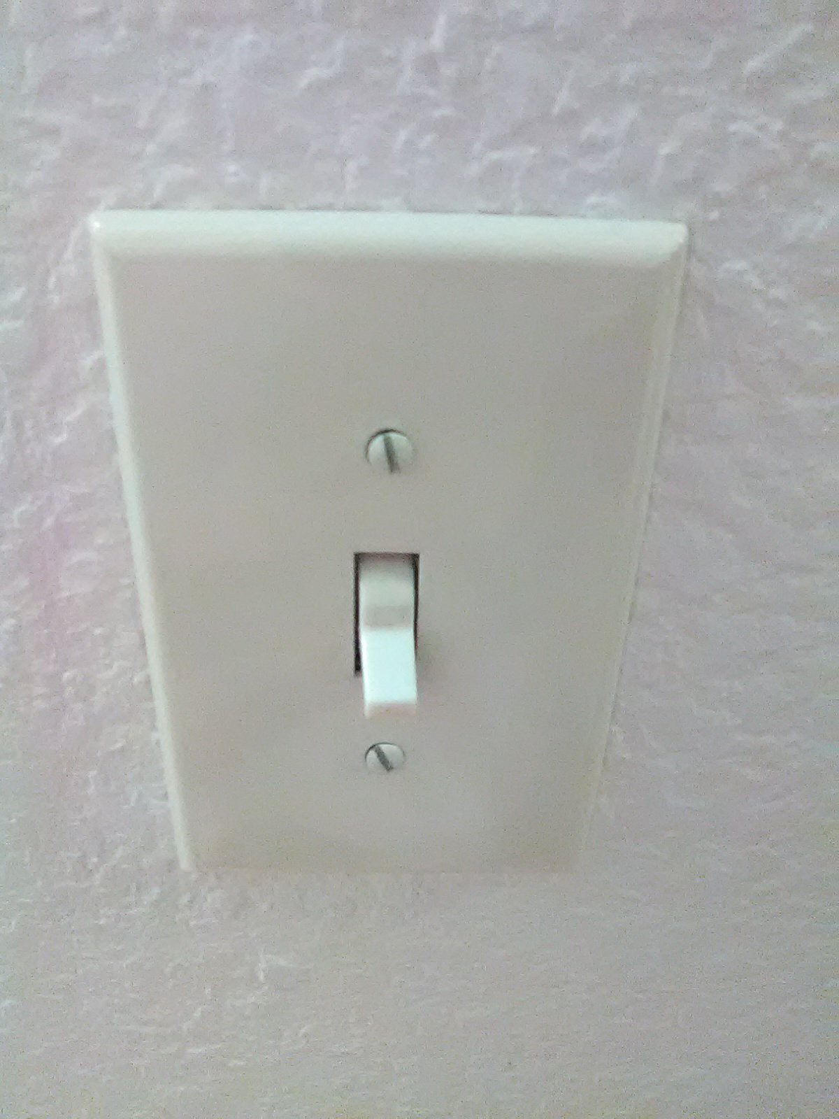 Outlet with improper fasteners.