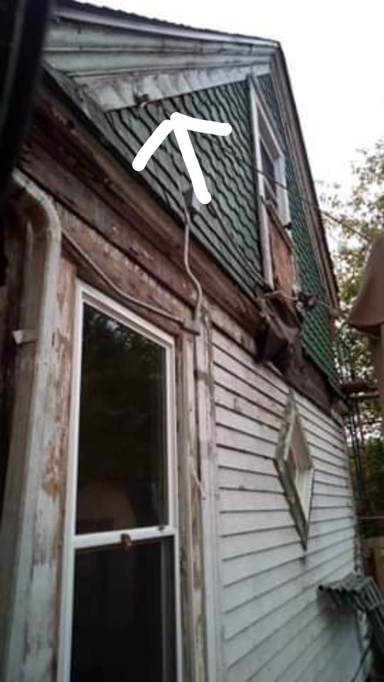 Incomplete job, siding still on the house. 