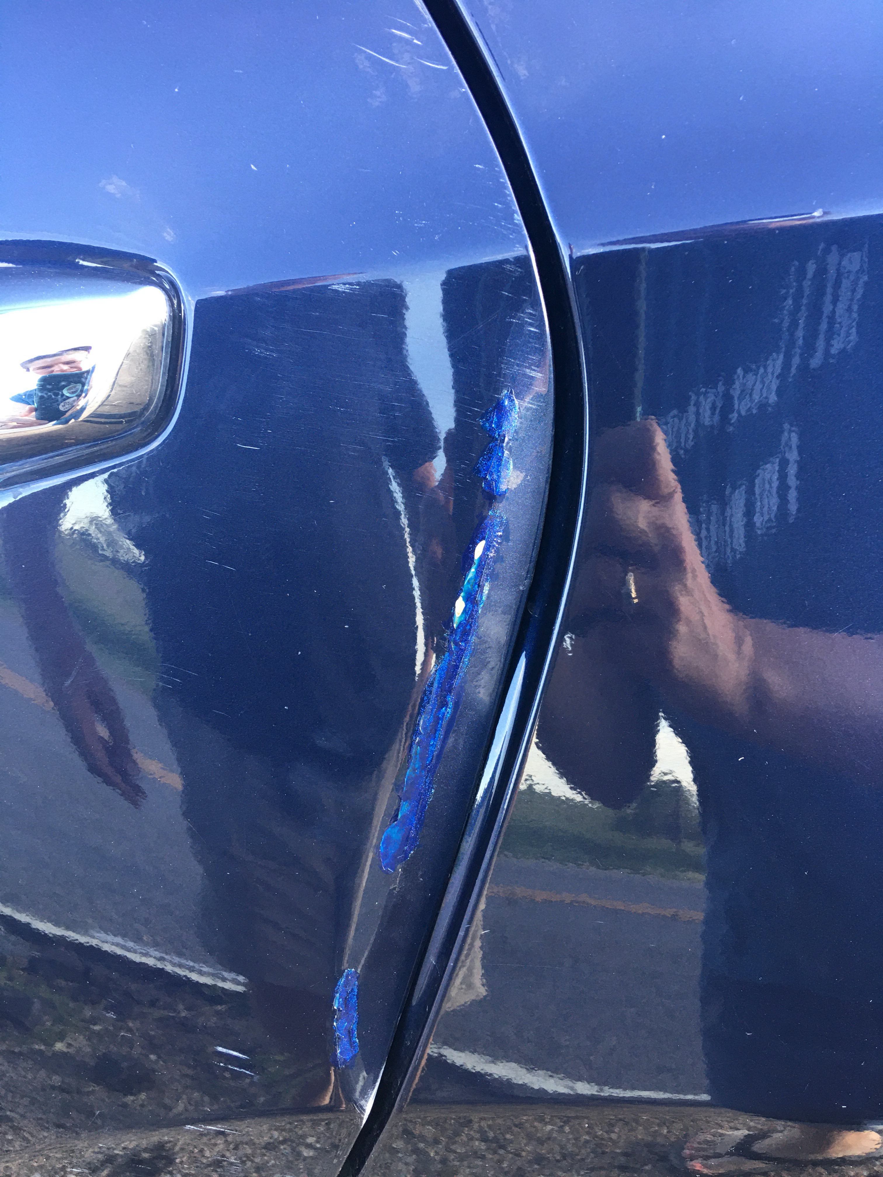 Bent door from backing out of garage