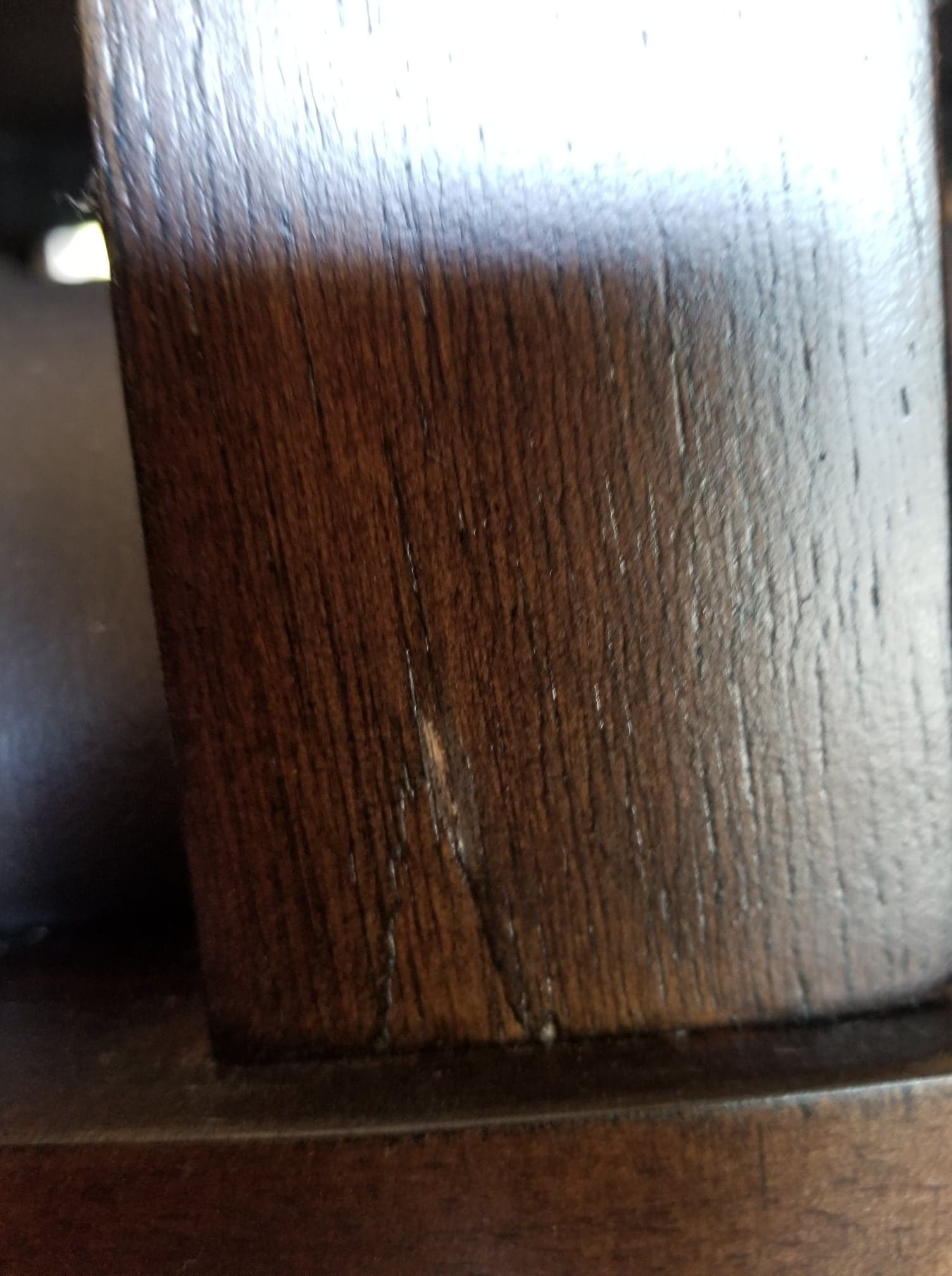 Cracked slat on back of some slats of chairs